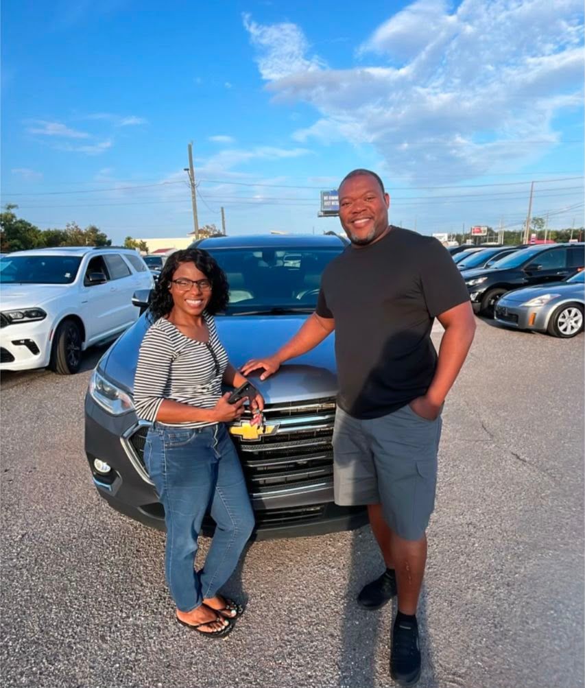 Couple picking up their new vehicle together