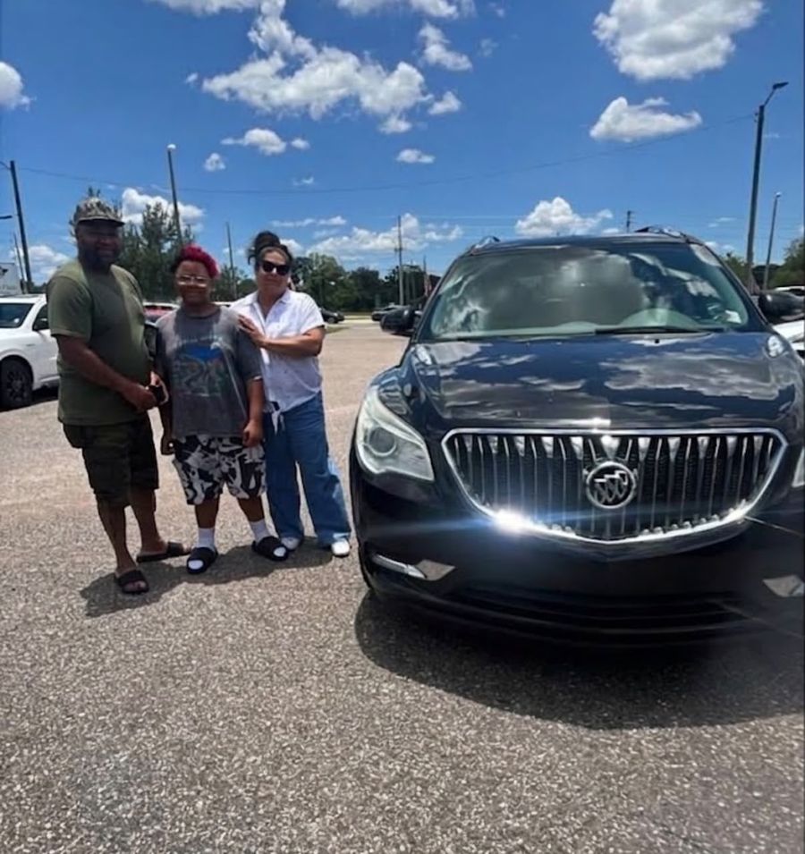 Family picking up their new SUV together